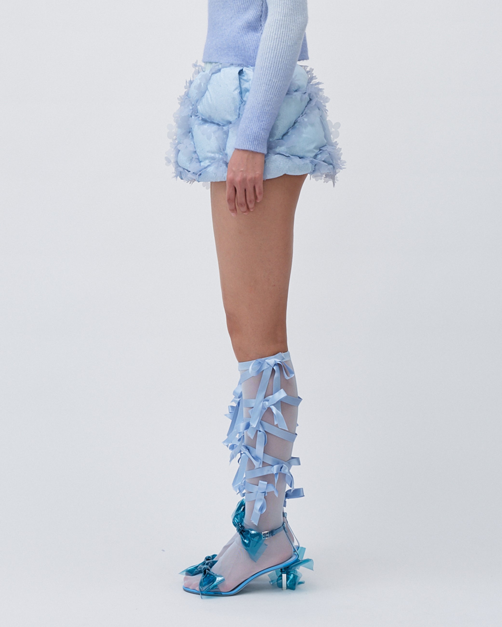WOMENS MINI SKIRT QUILTED PUFFER SKIRT WITH LASER CUT FLOWERS AND ELASTIC WAISTBAND BLUE